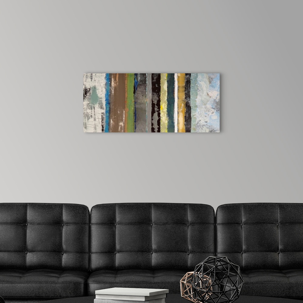 A modern room featuring Grunge contemporary art featuring varying vertical lines of colors with a distressed look.