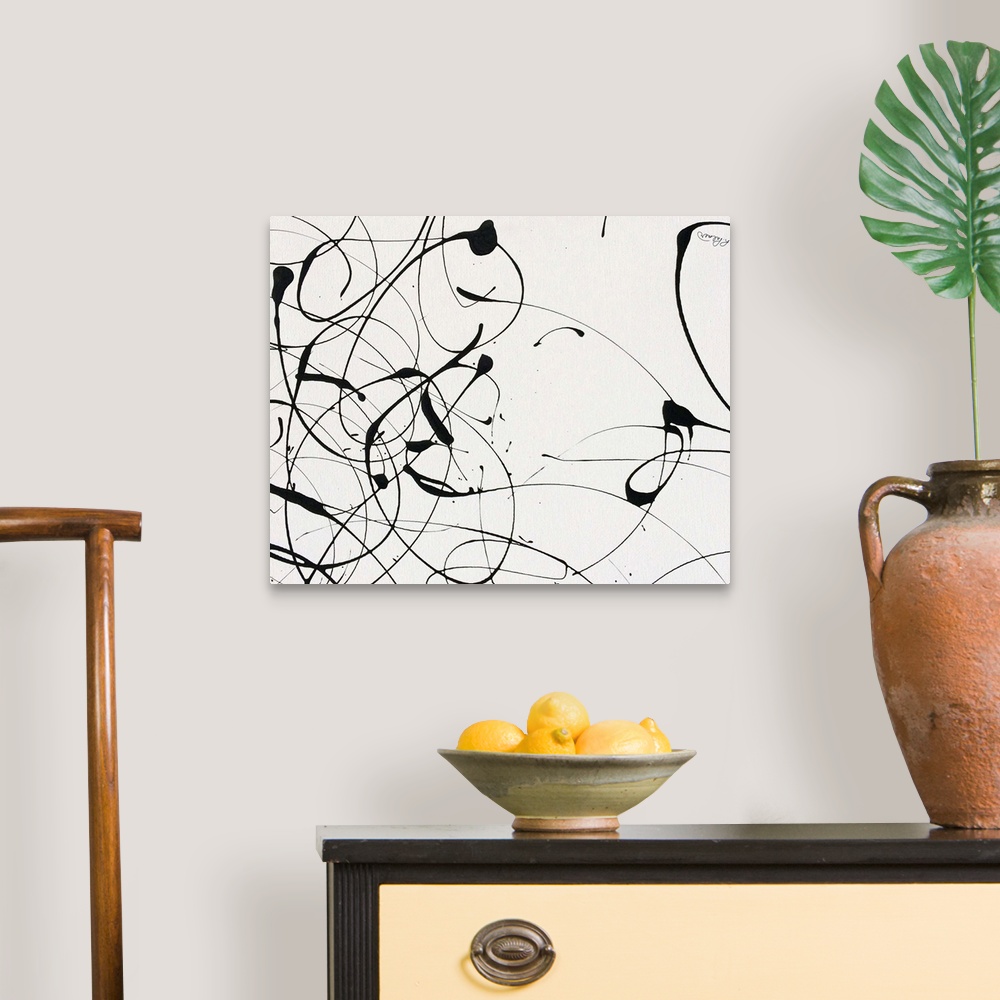 A traditional room featuring A contemporary abstract painting of black paint drizzle on a tan background.