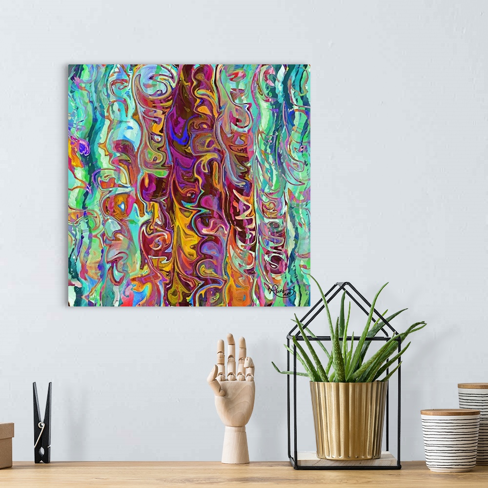 A bohemian room featuring Square abstract art with vertical wave-like patterns of bright colors meshed together.