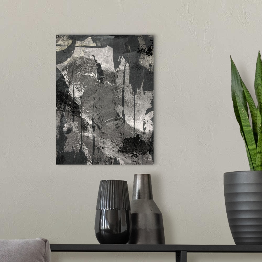 A modern room featuring Black, white, and gray abstract painting.