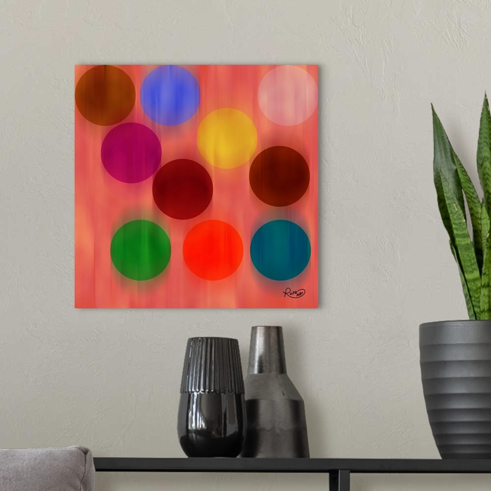A modern room featuring Square abstract art with a pink background and faded falling circles in different colors.