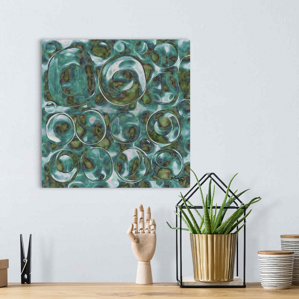A bohemian room featuring Square abstract art with translucent bubble like circles made out of green and blue hues.