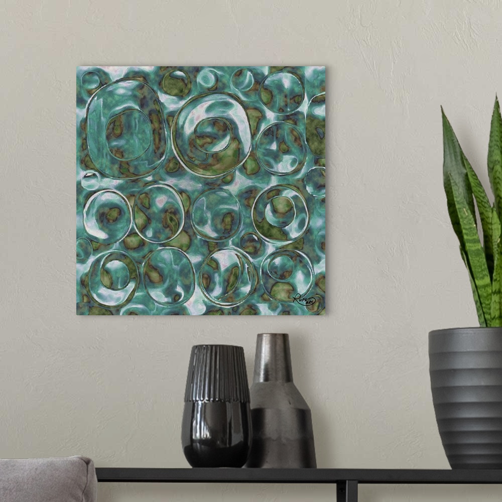 A modern room featuring Square abstract art with translucent bubble like circles made out of green and blue hues.