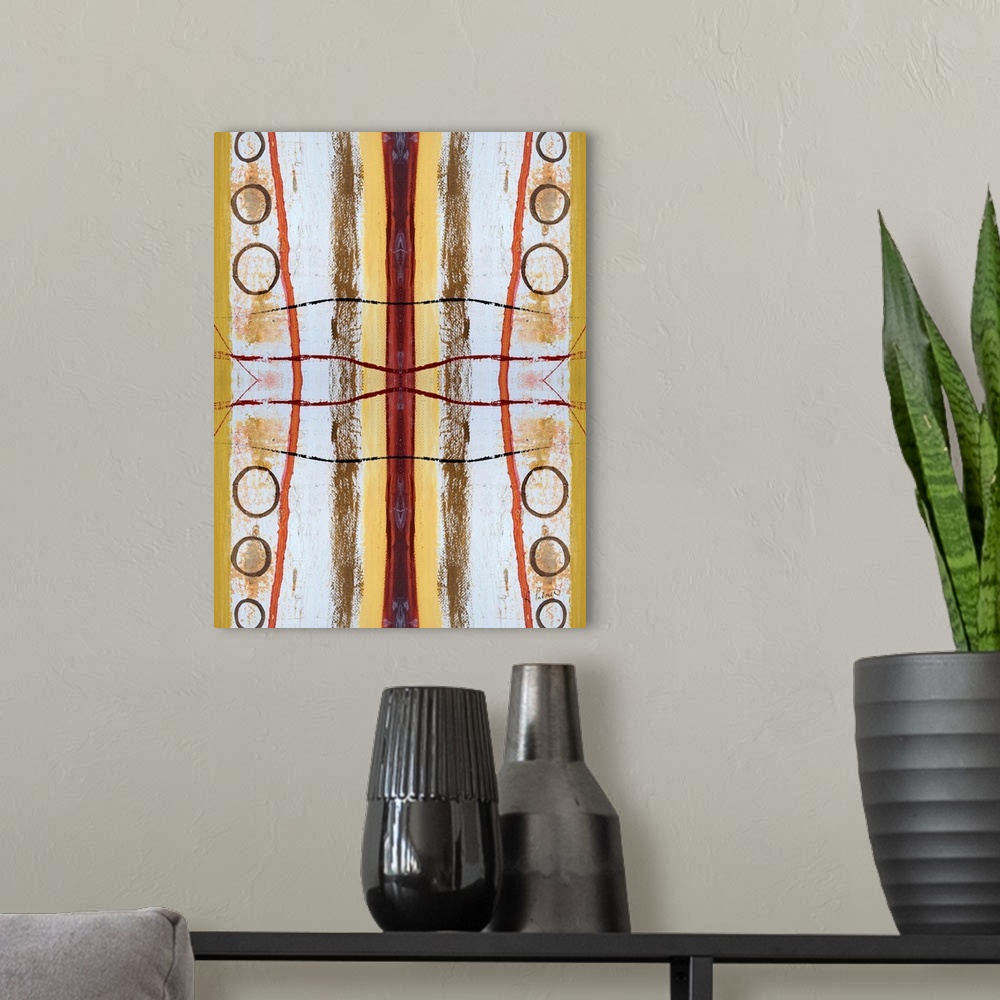 A modern room featuring Abstract contemporary painting resembling a kaleidoscopic image, in yellow, orange, and white tones.