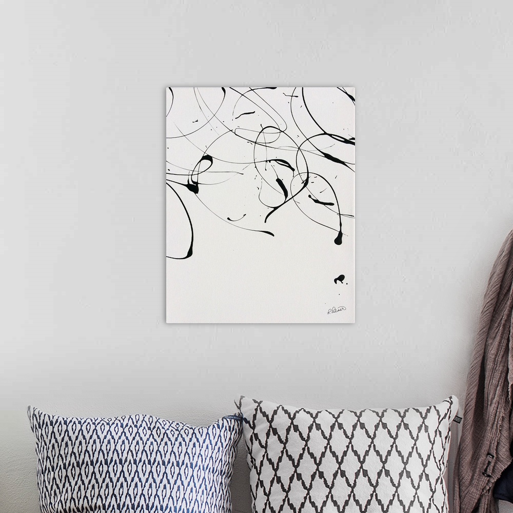 A bohemian room featuring A contemporary abstract painting of black paint drizzle on a tan background.