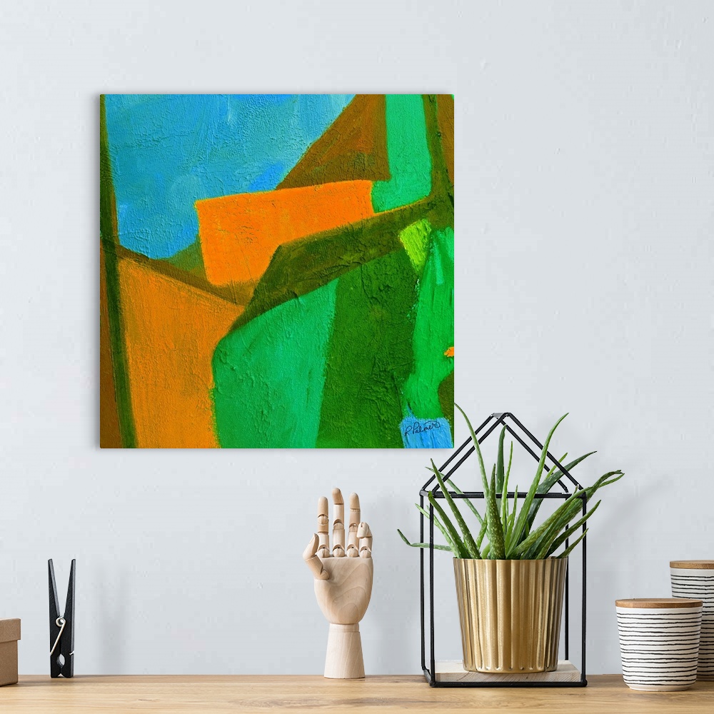 A bohemian room featuring Bright square abstract painting with green, blue, and orange shapes fitting perfectly together wi...