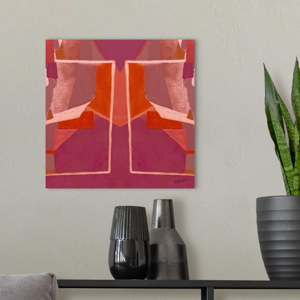 A modern room featuring Square abstract painting with pink and orange symmetrical designs.