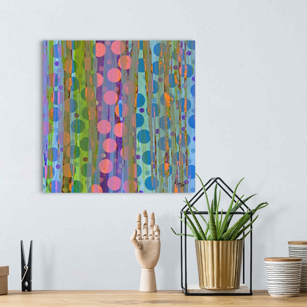 A bohemian room featuring Contemporary digital art of several circles in vibrant colors intersecting with vertical lines.