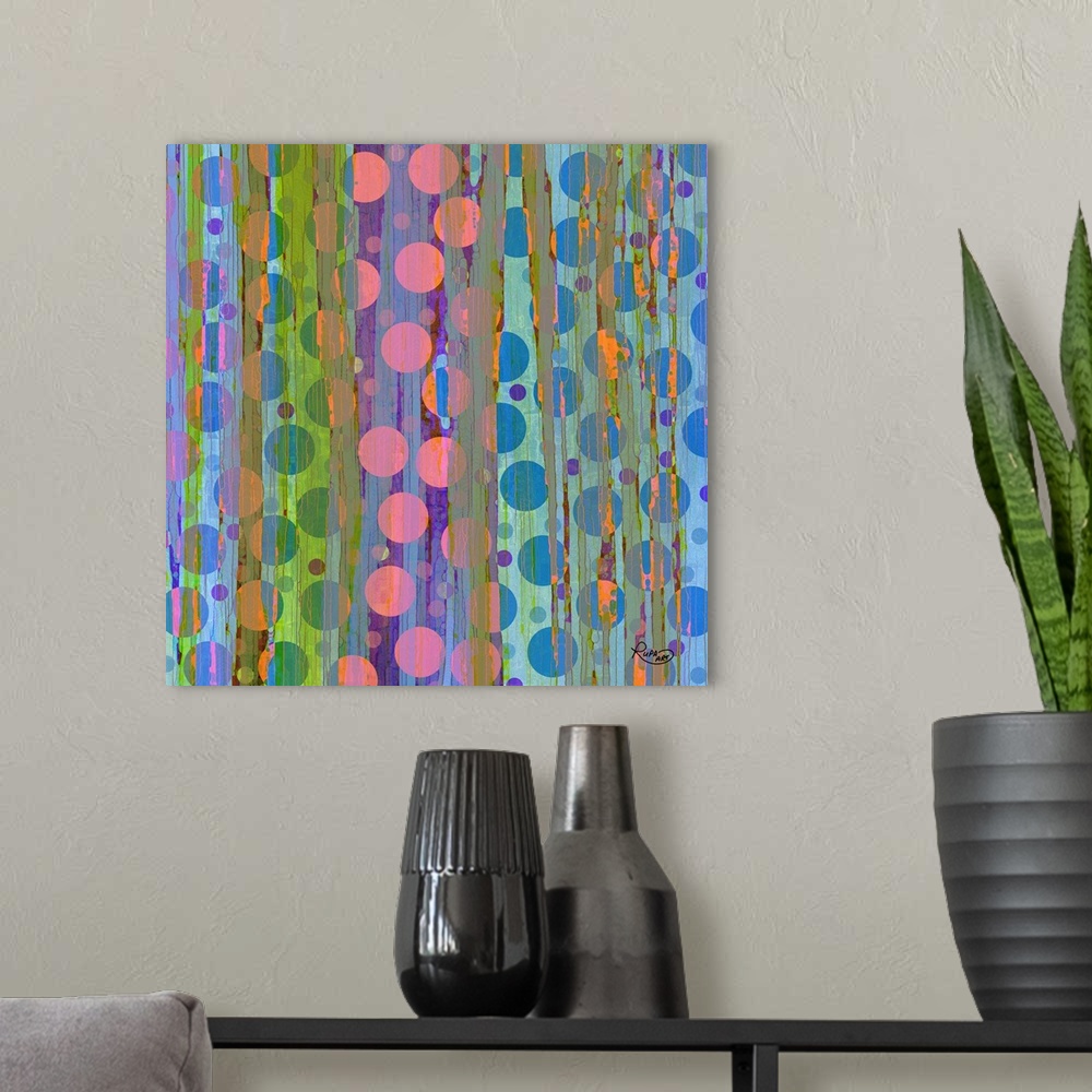 A modern room featuring Contemporary digital art of several circles in vibrant colors intersecting with vertical lines.
