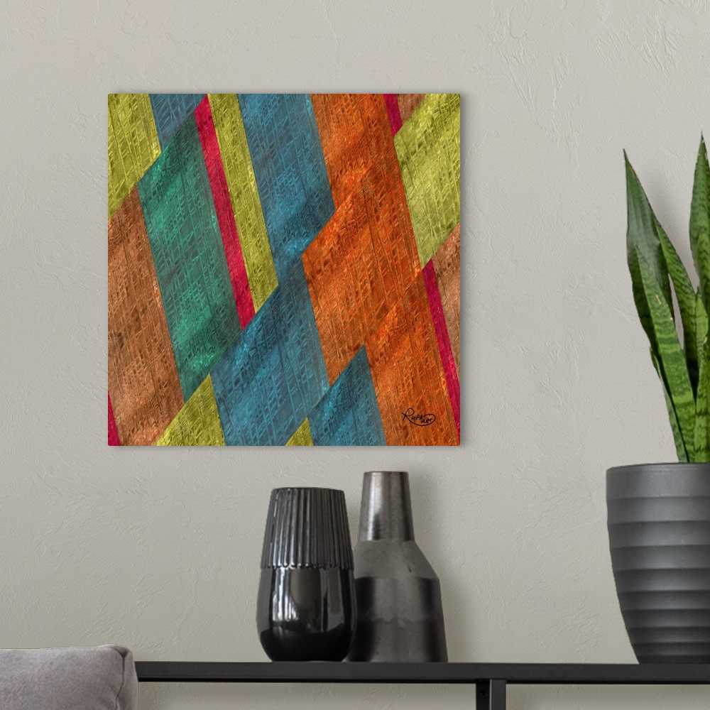 A modern room featuring Square abstract artwork in shades of orange, blue and green in a diagonal striped design.