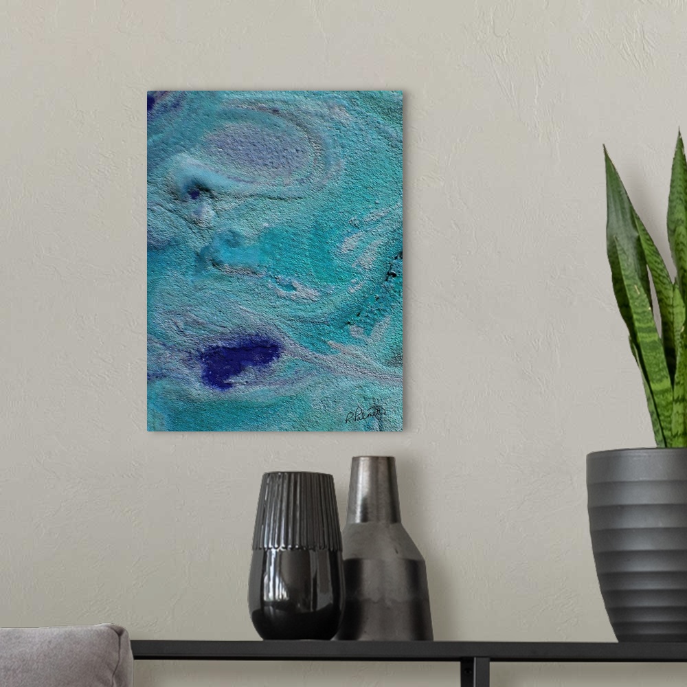 A modern room featuring Contemporary abstract painting using swirling teal and blue colors.