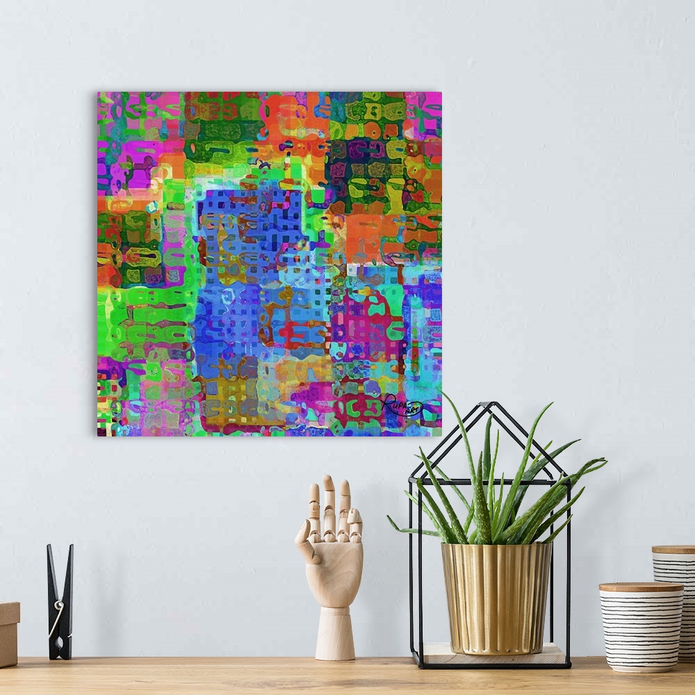 A bohemian room featuring Square abstract art with very colorful shapes and patterns all combined together.