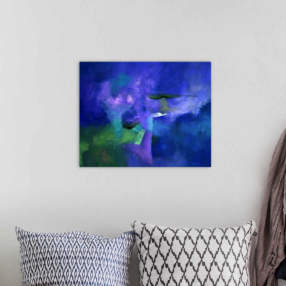 A bohemian room featuring Abstract painting with powering blue hues with hints of purple, green, and black layered on top.