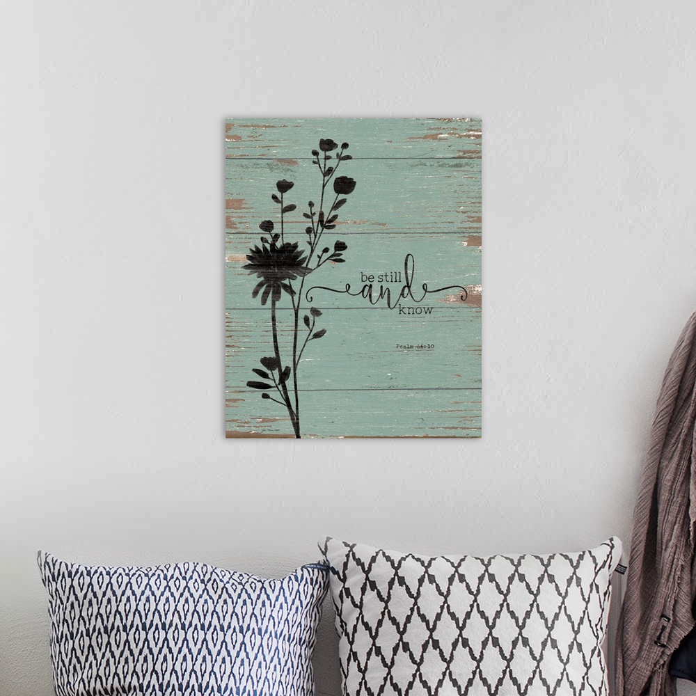 A bohemian room featuring "Be Still and Know" Psalm 46:10