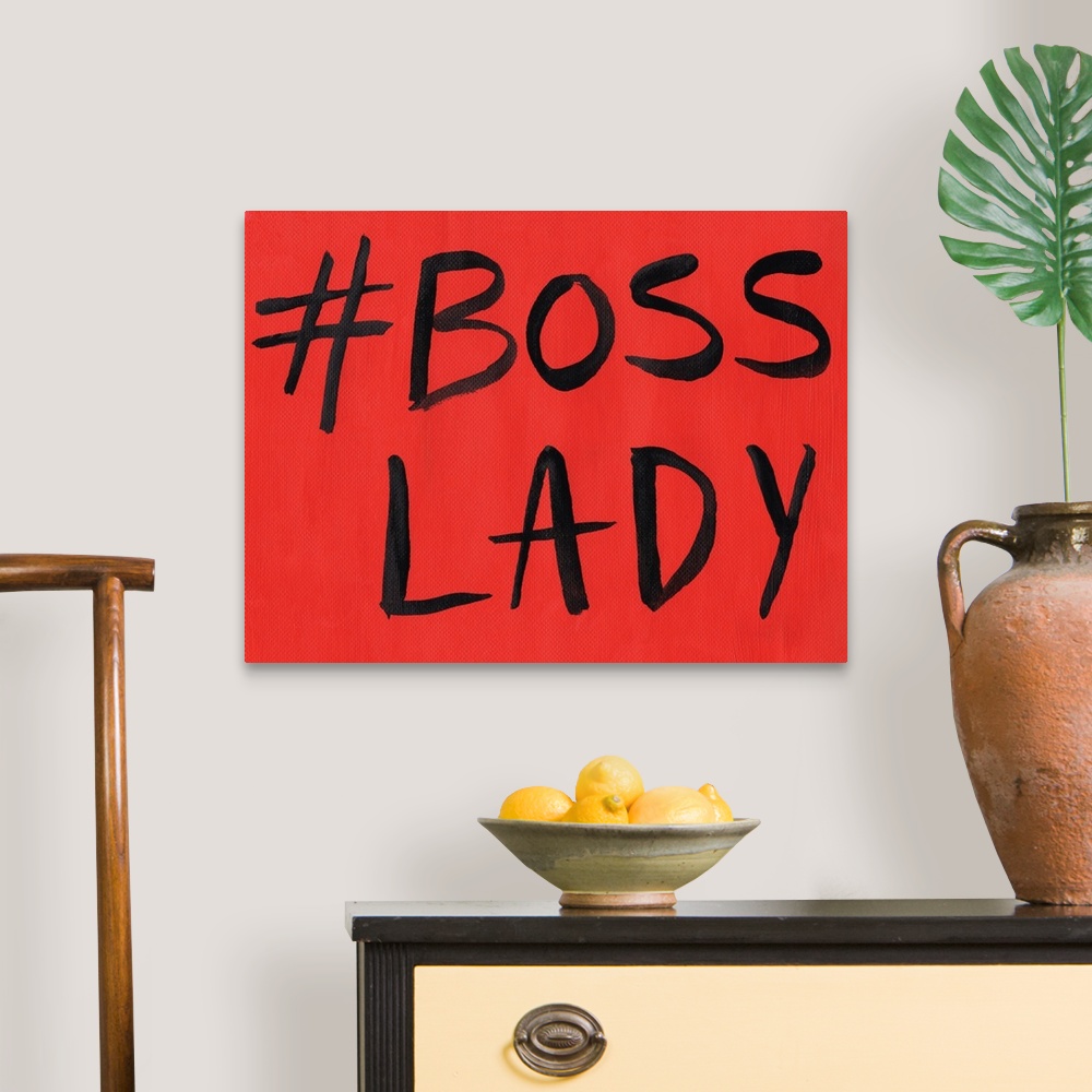 A traditional room featuring This artwork features the hashtag, "Boss Lady" in black text over a red background.