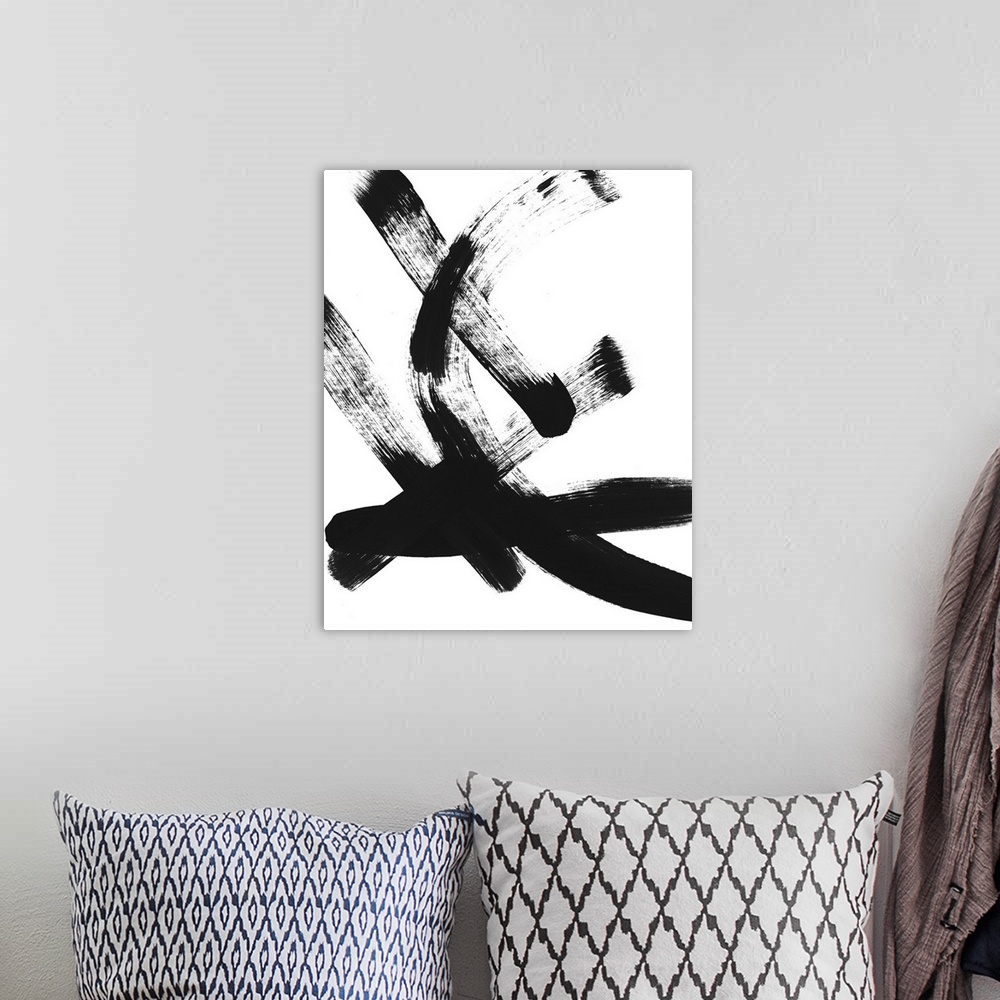 A bohemian room featuring Abstract contemporary artwork with broad pitch black brush strokes on white.