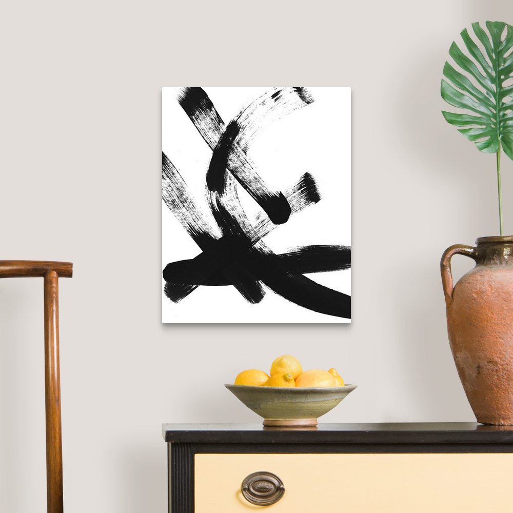 A traditional room featuring Abstract contemporary artwork with broad pitch black brush strokes on white.