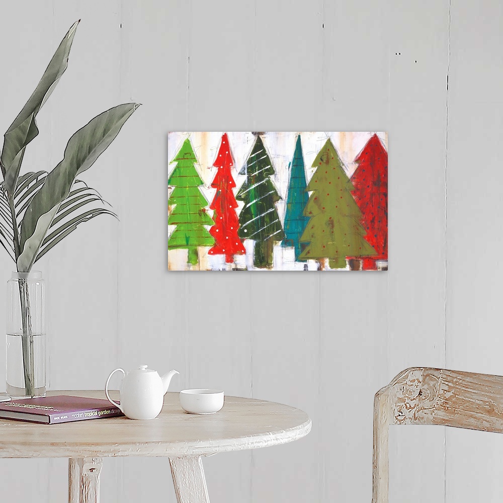 A farmhouse room featuring Contemporary painting of different colored and patterned Christmas trees, against a gray background.