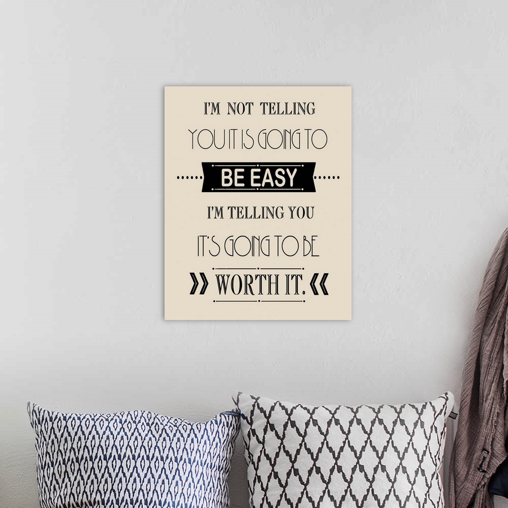 A bohemian room featuring Typographic inspirational artwork using black text against a cream toned background.