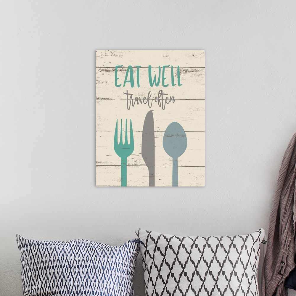A bohemian room featuring Contemporary art of eating utensils  beneath inspirational text, on a background of horizontal wo...