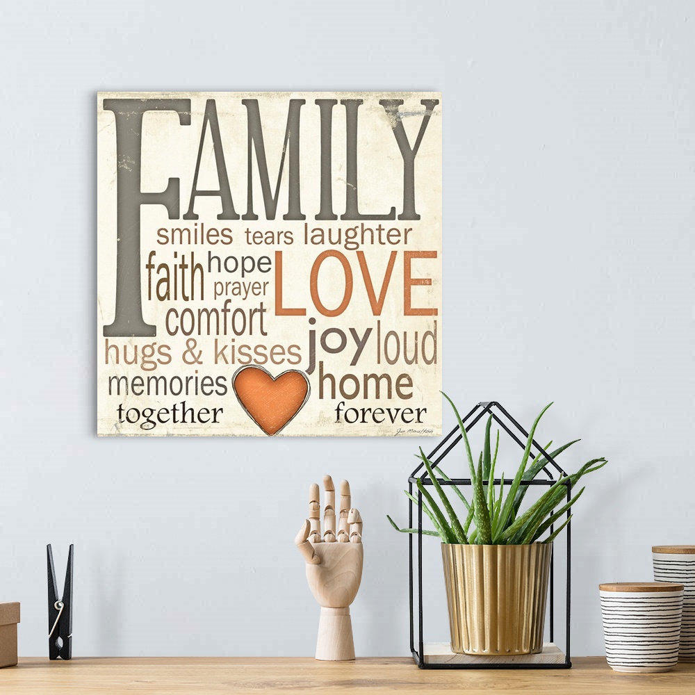A bohemian room featuring Square wall art of different descriptive words describing a family on a neutral backdrop.