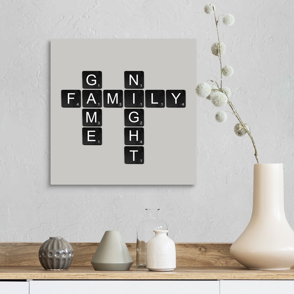 A farmhouse room featuring "Family Game Night" spelled out in black and white scrabble tiles.