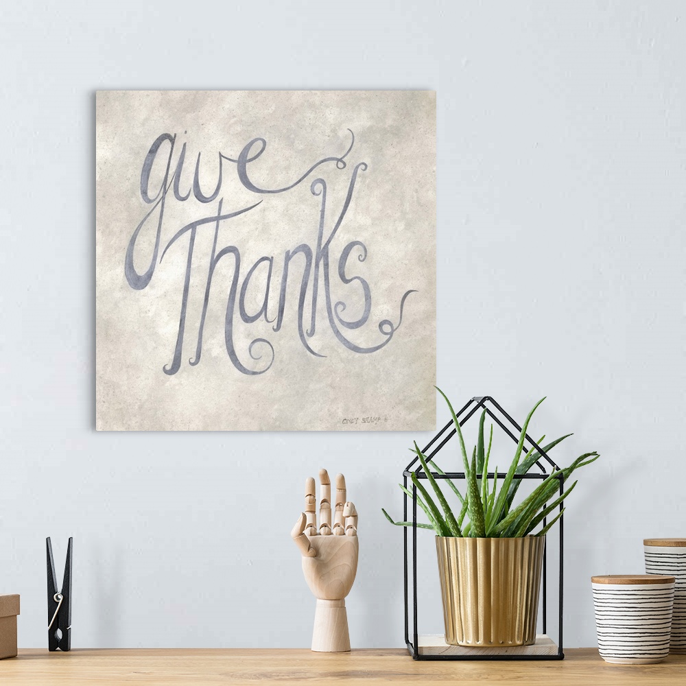A bohemian room featuring Handlettered Thanksgiving artwork in grey script on a neutral background.
