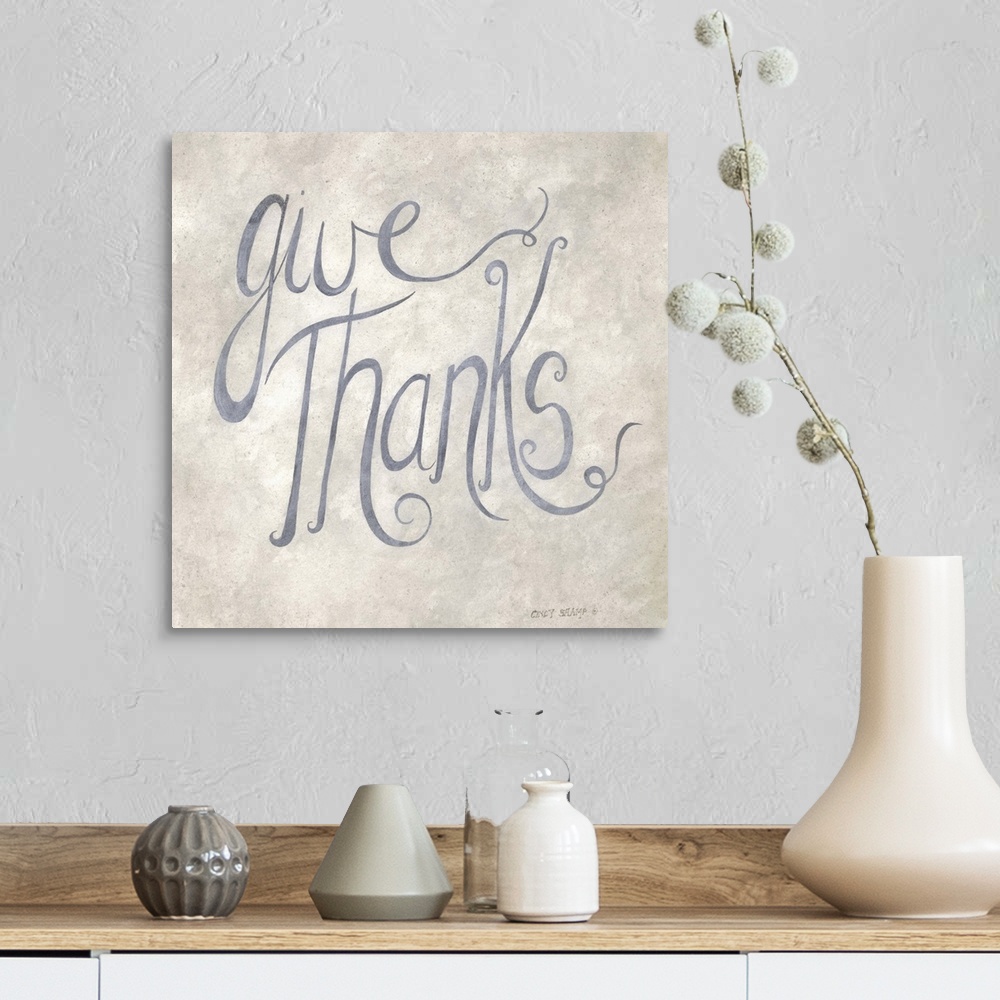 A farmhouse room featuring Handlettered Thanksgiving artwork in grey script on a neutral background.