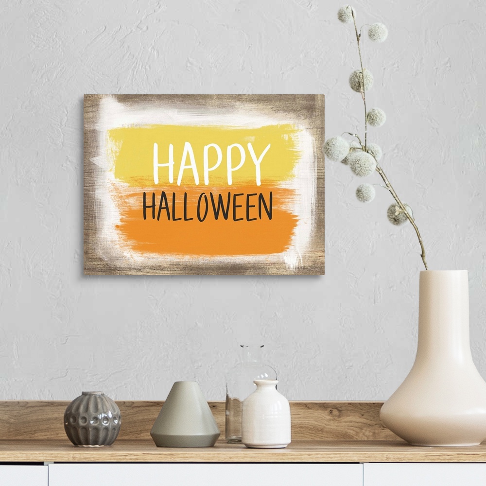 A farmhouse room featuring Halloween typography artwork with a painted wooden board effect in yellow and orange.