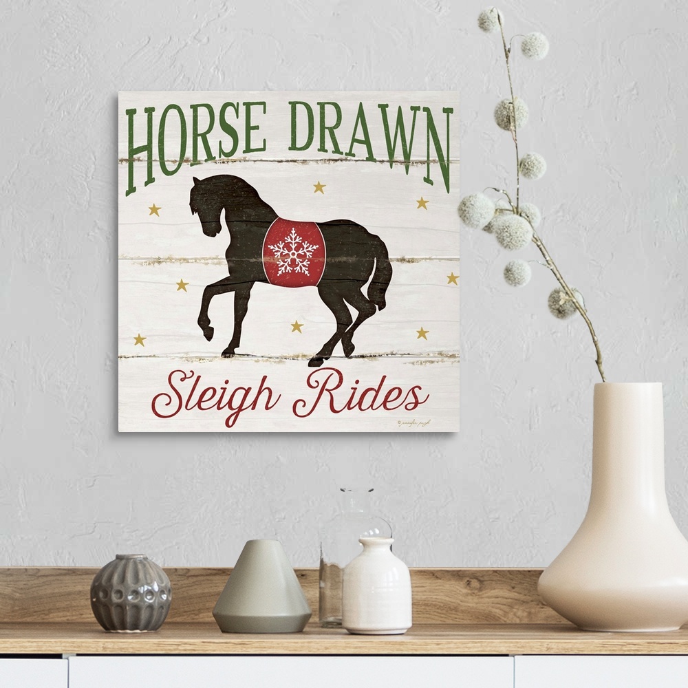 A farmhouse room featuring Christmas themed typography artwork in festive seasonal colors.