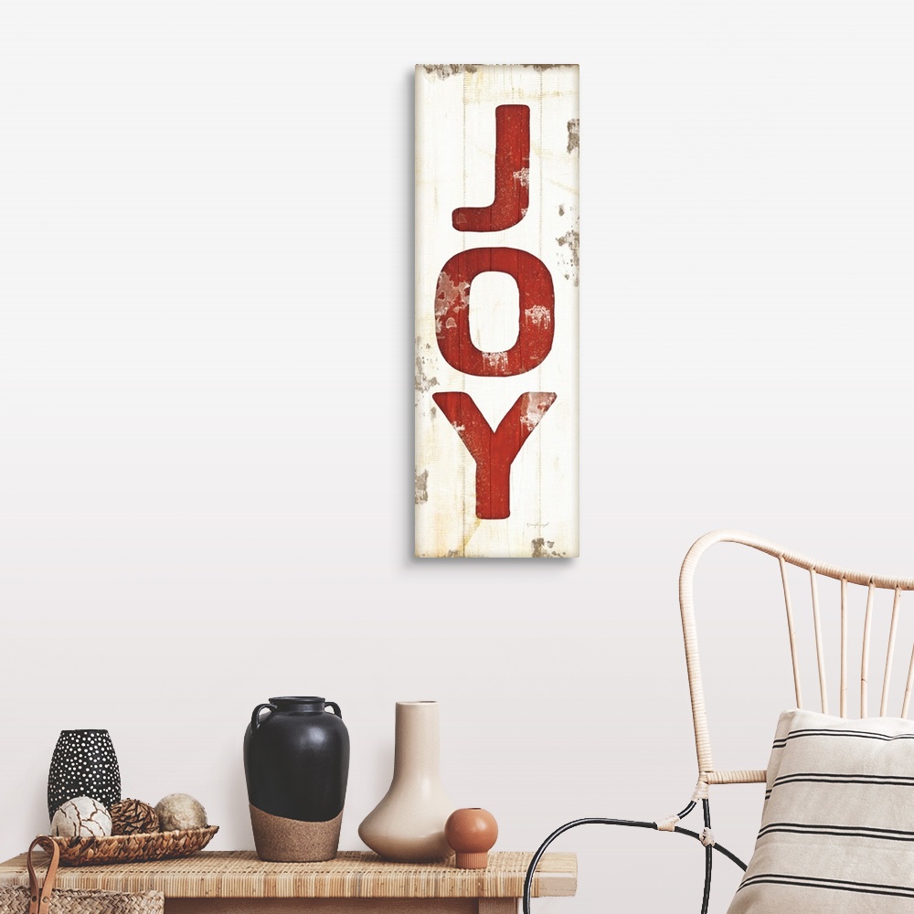 A farmhouse room featuring Christmas themed typography artwork in festive seasonal colors against a distressed background.