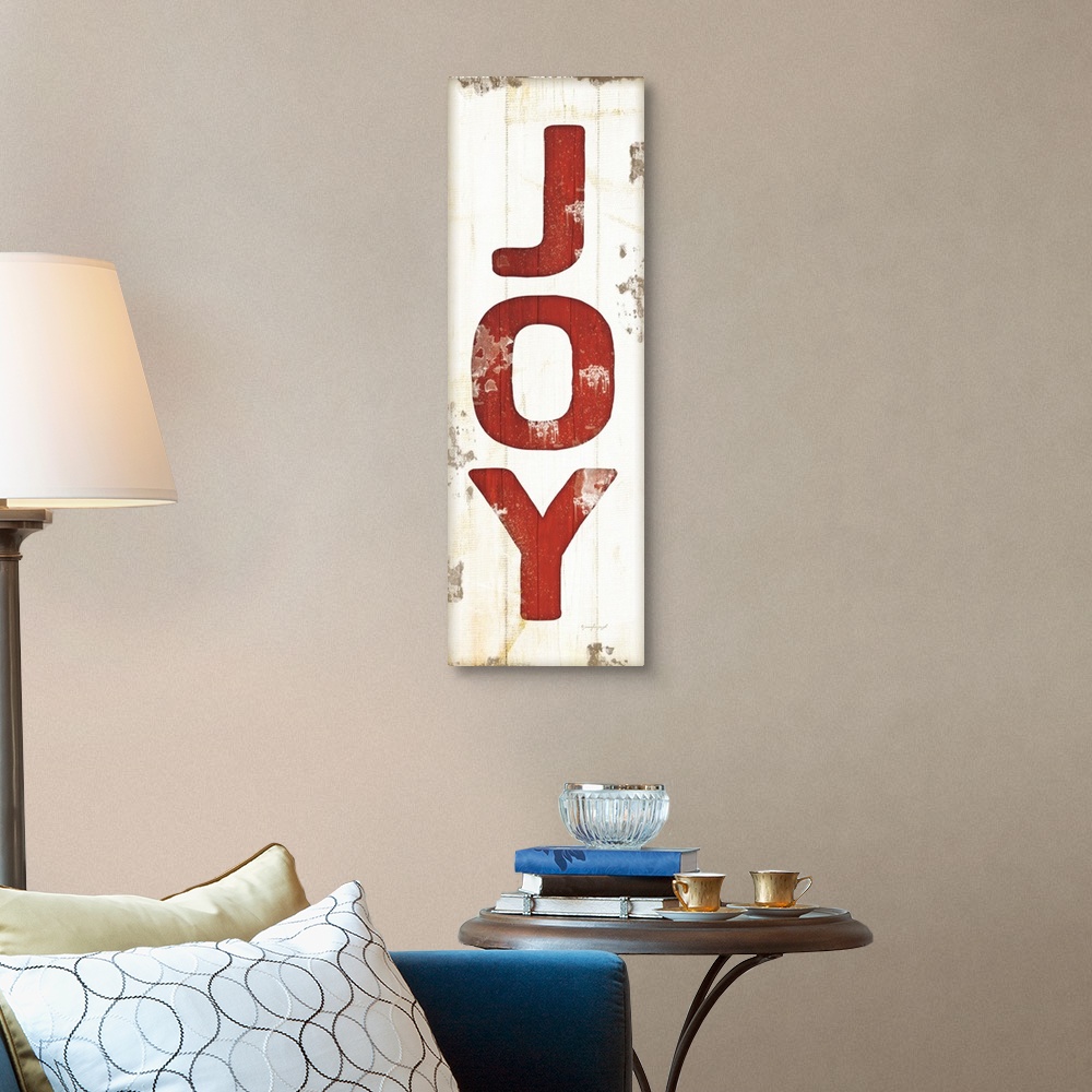 A traditional room featuring Christmas themed typography artwork in festive seasonal colors against a distressed background.
