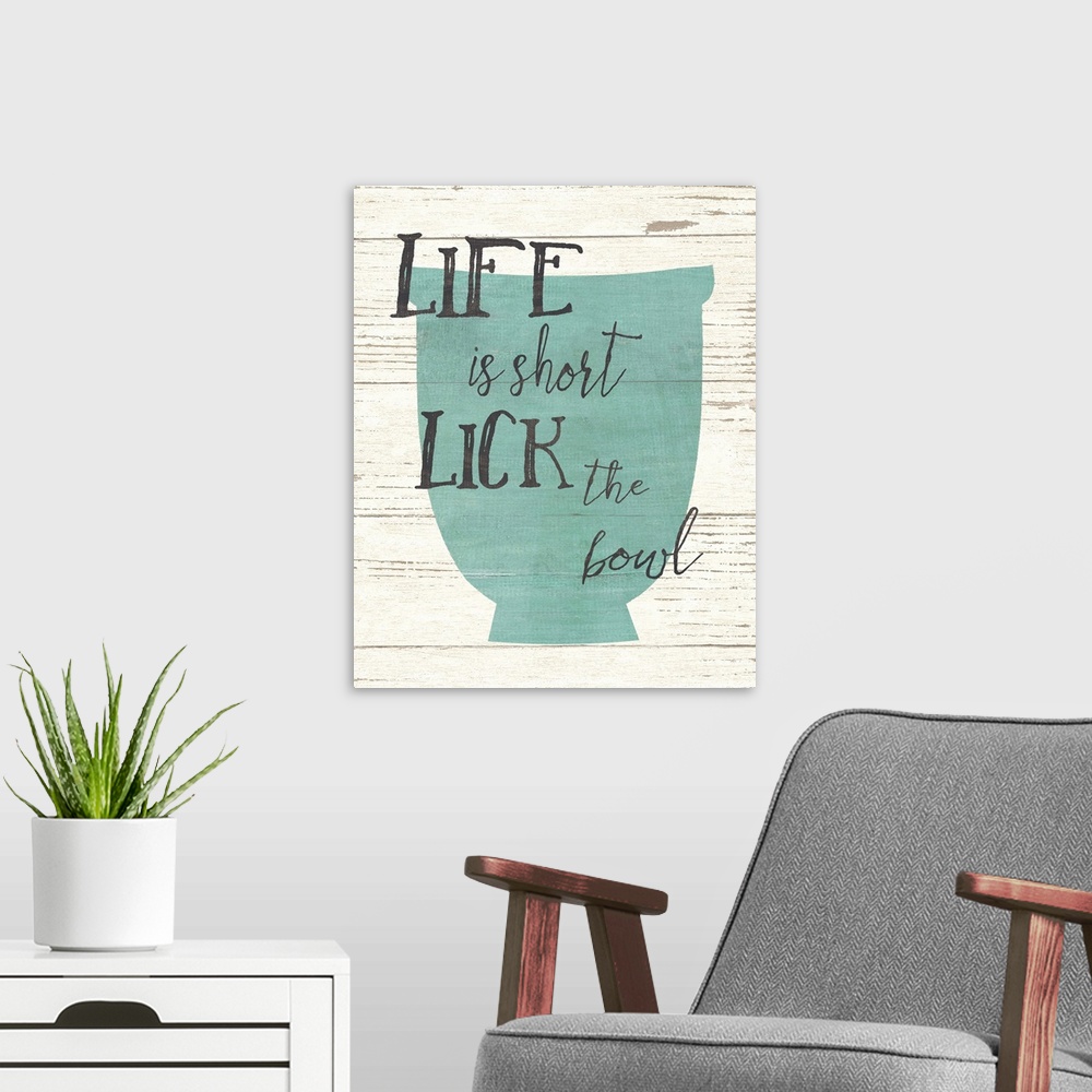 A modern room featuring Kitchen themed typography art with a blue bowl, over a weathered wood board.