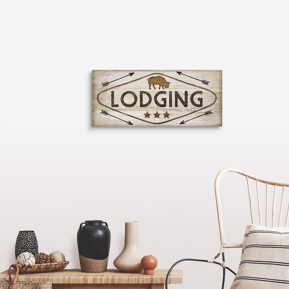 A farmhouse room featuring Contemporary cabin decor artwork of a wooden sign for Lodging.