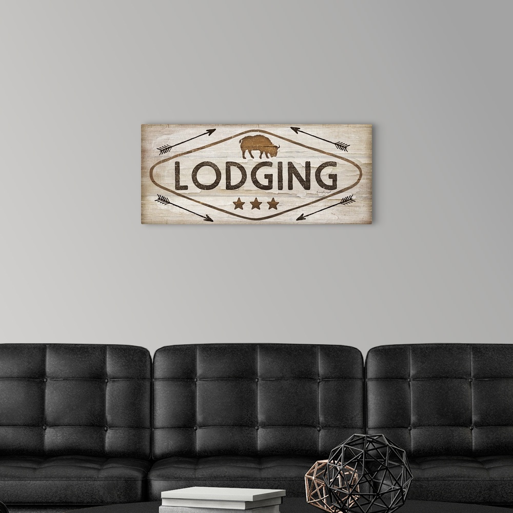 A modern room featuring Contemporary cabin decor artwork of a wooden sign for Lodging.