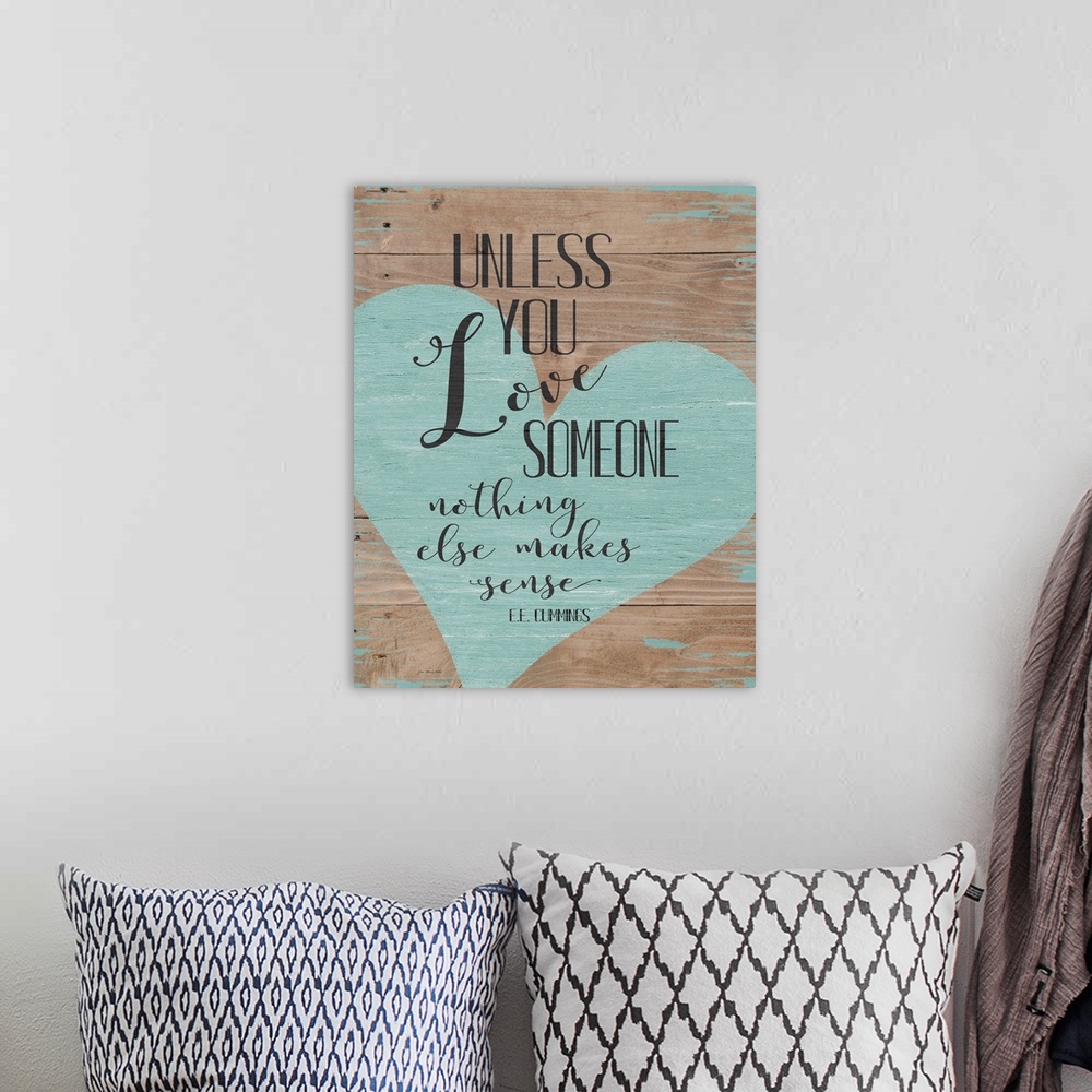 A bohemian room featuring Distressed typographic art with a heart on a shiplap wood background.