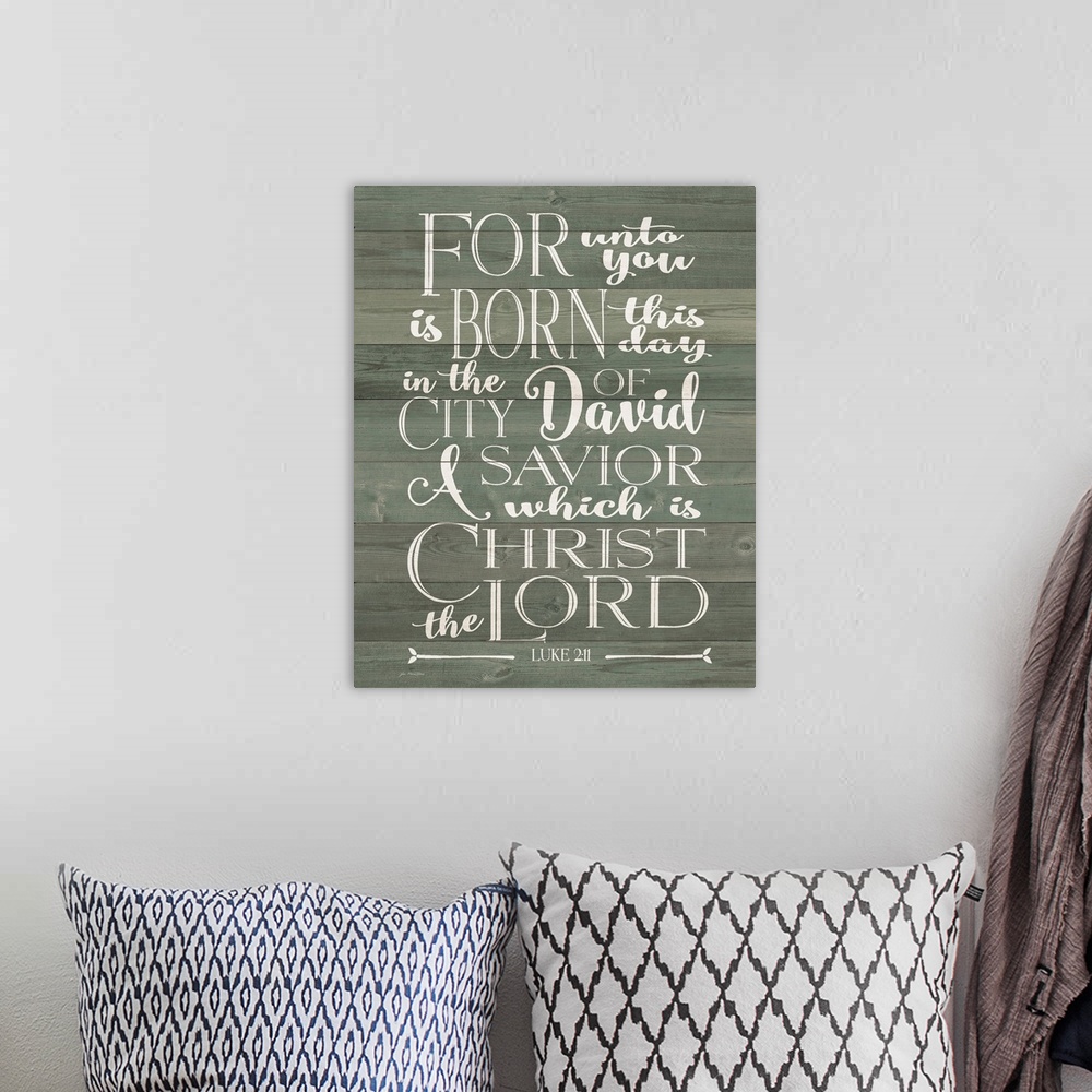 A bohemian room featuring Luke 2:11 on a wood paneled background