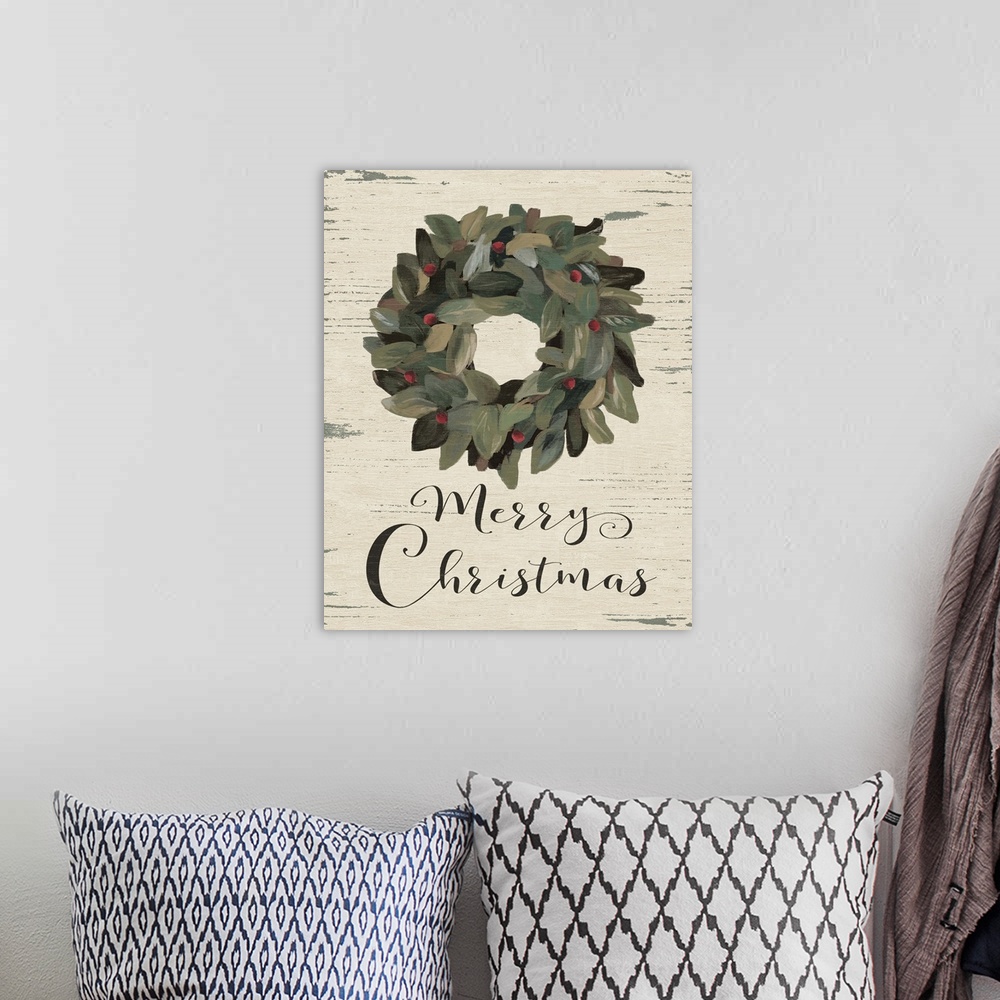 A bohemian room featuring A decorative wreath with the phrase "Merry Christmas" painted on a wooden background.