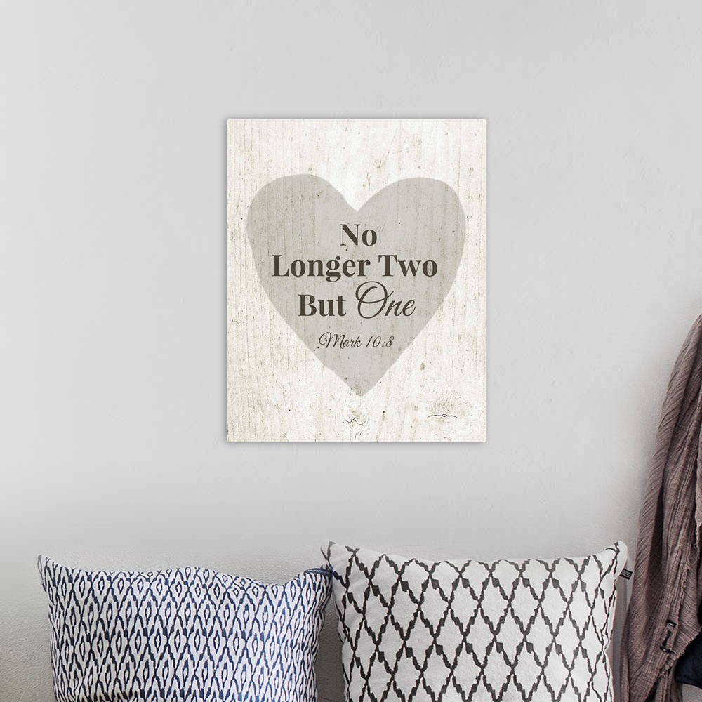 A bohemian room featuring Wedding themed typography art of Bible verse Mark 10:8, over a grey heart on white barnwood.