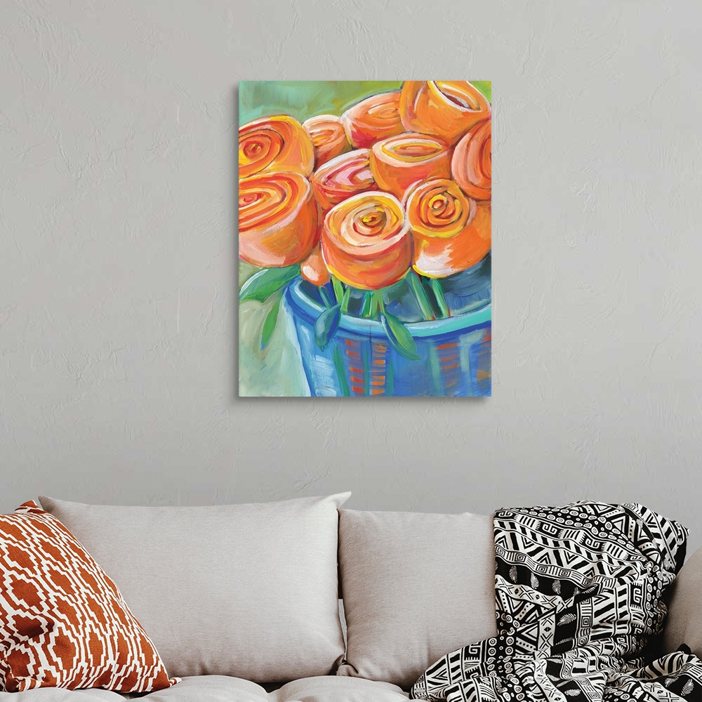 A bohemian room featuring Contemporary painting of a vase holding orange tulips.