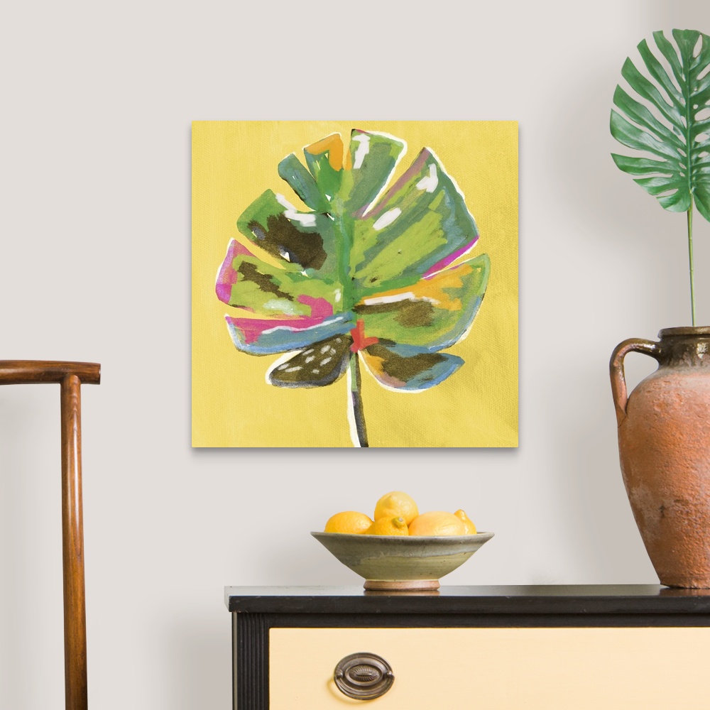 A traditional room featuring Square painting of a colorful palm leaf on a yellow background.