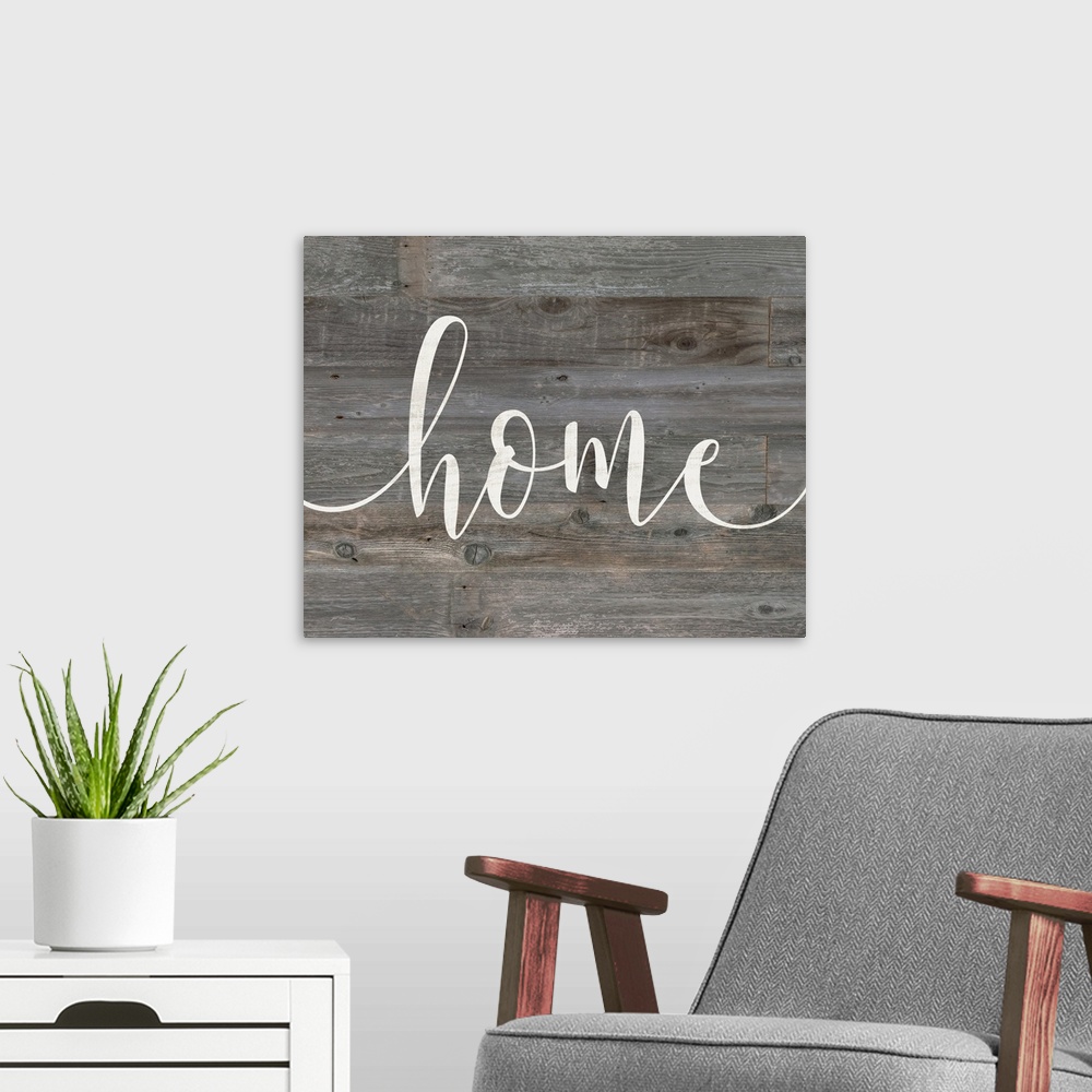 A modern room featuring "home" against gray shiplap wood background.