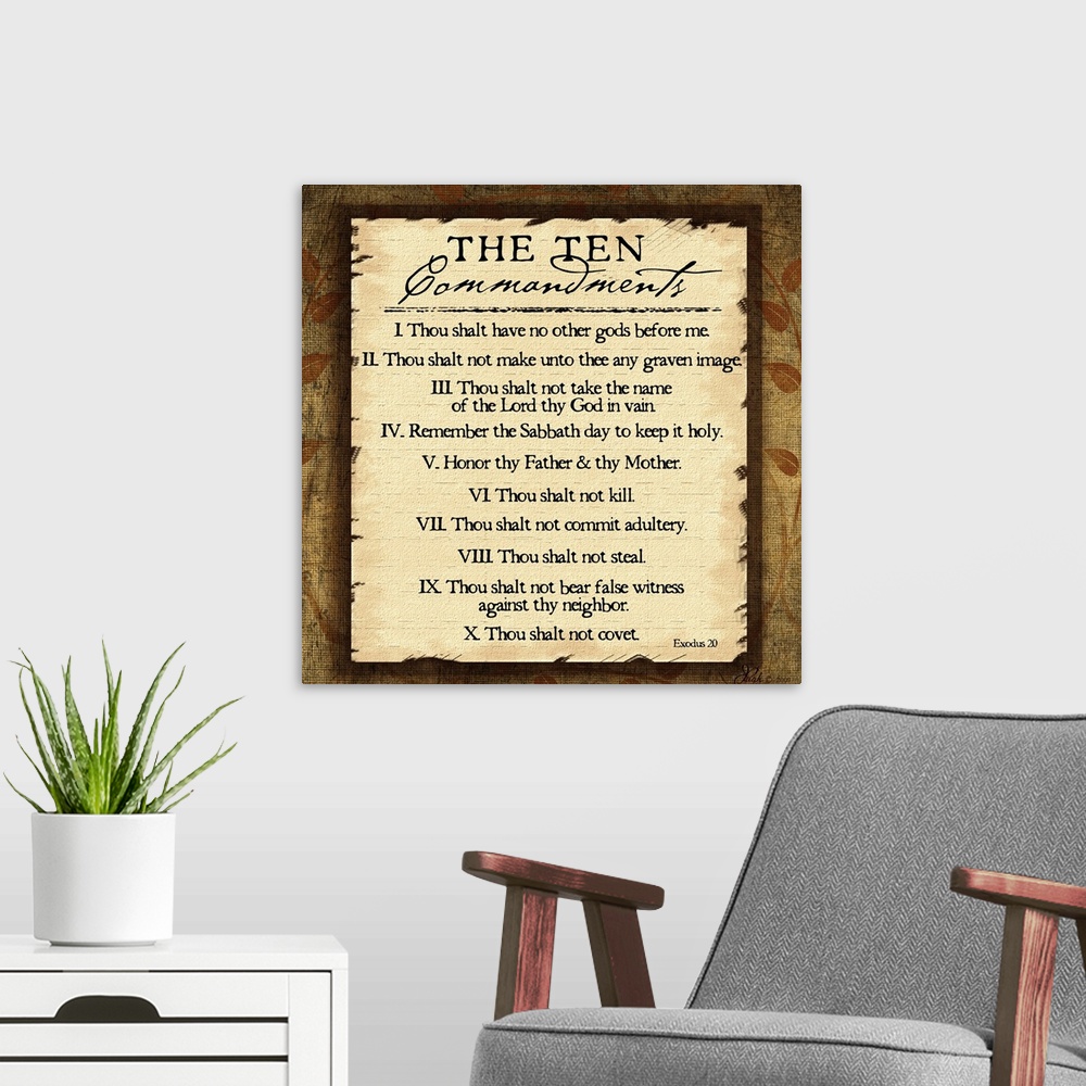 A modern room featuring This large square piece lists the ten commandments with a decorative border around them.