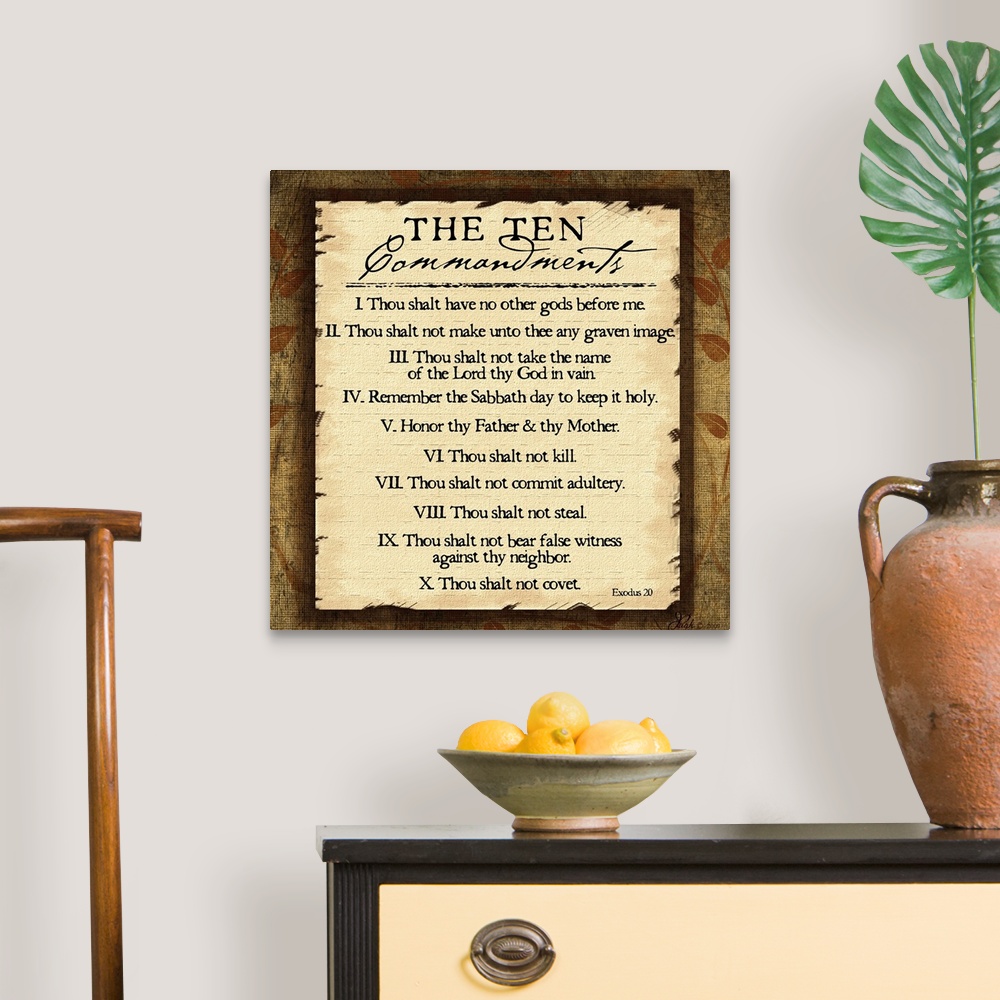 A traditional room featuring This large square piece lists the ten commandments with a decorative border around them.