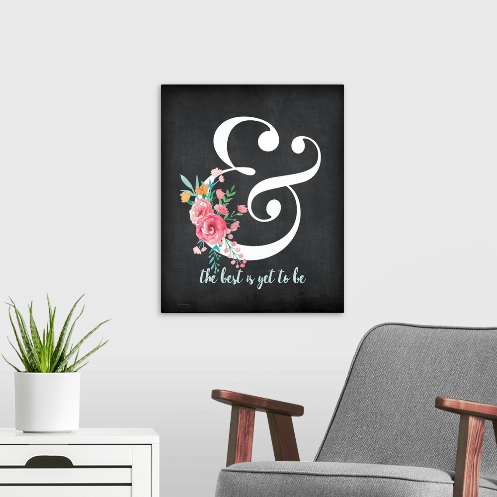 A modern room featuring "The best is yet to be" with flowers on a chalkboard style background.