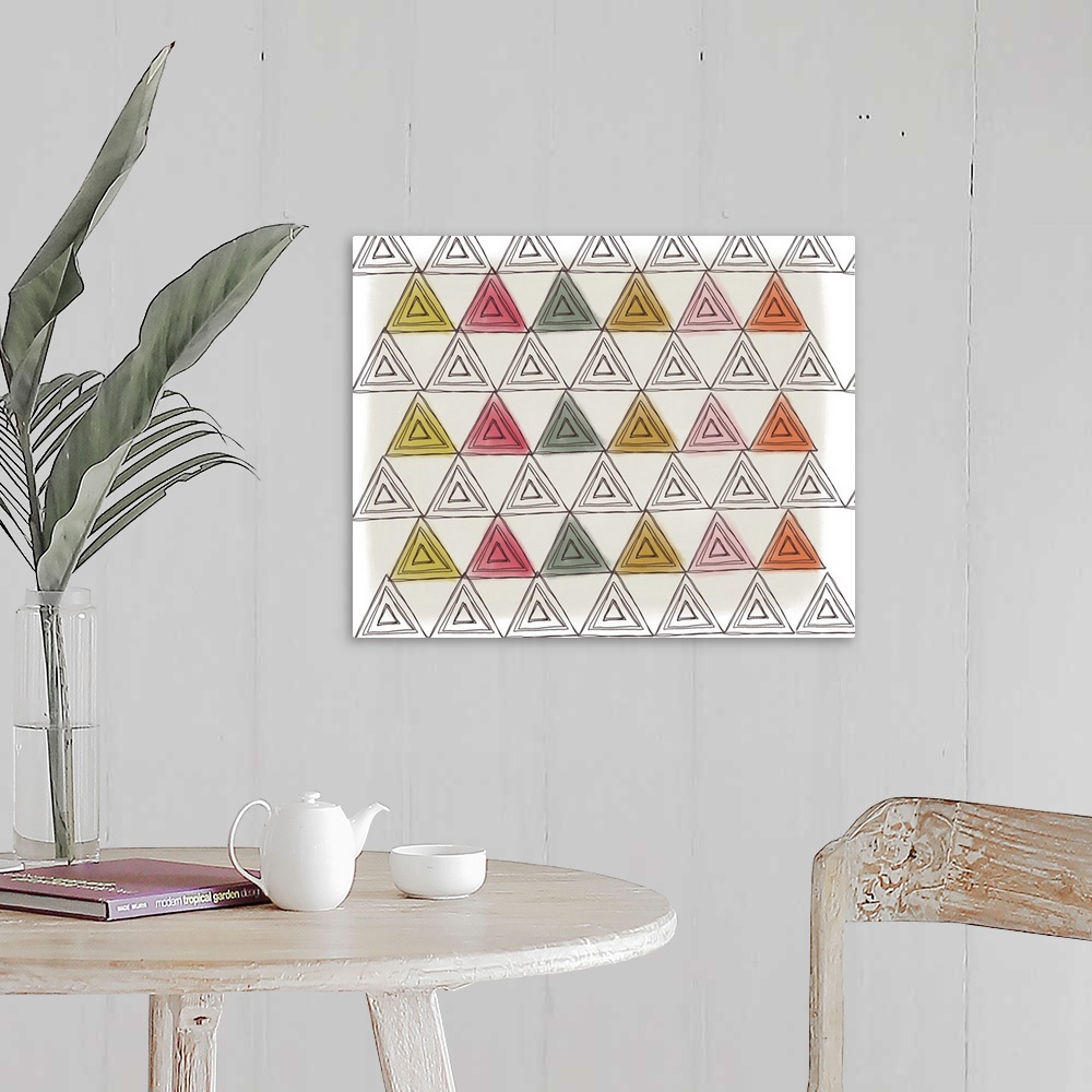 A farmhouse room featuring Patterned illustration made up of triangles in shades of green, yellow, orange, and pink.