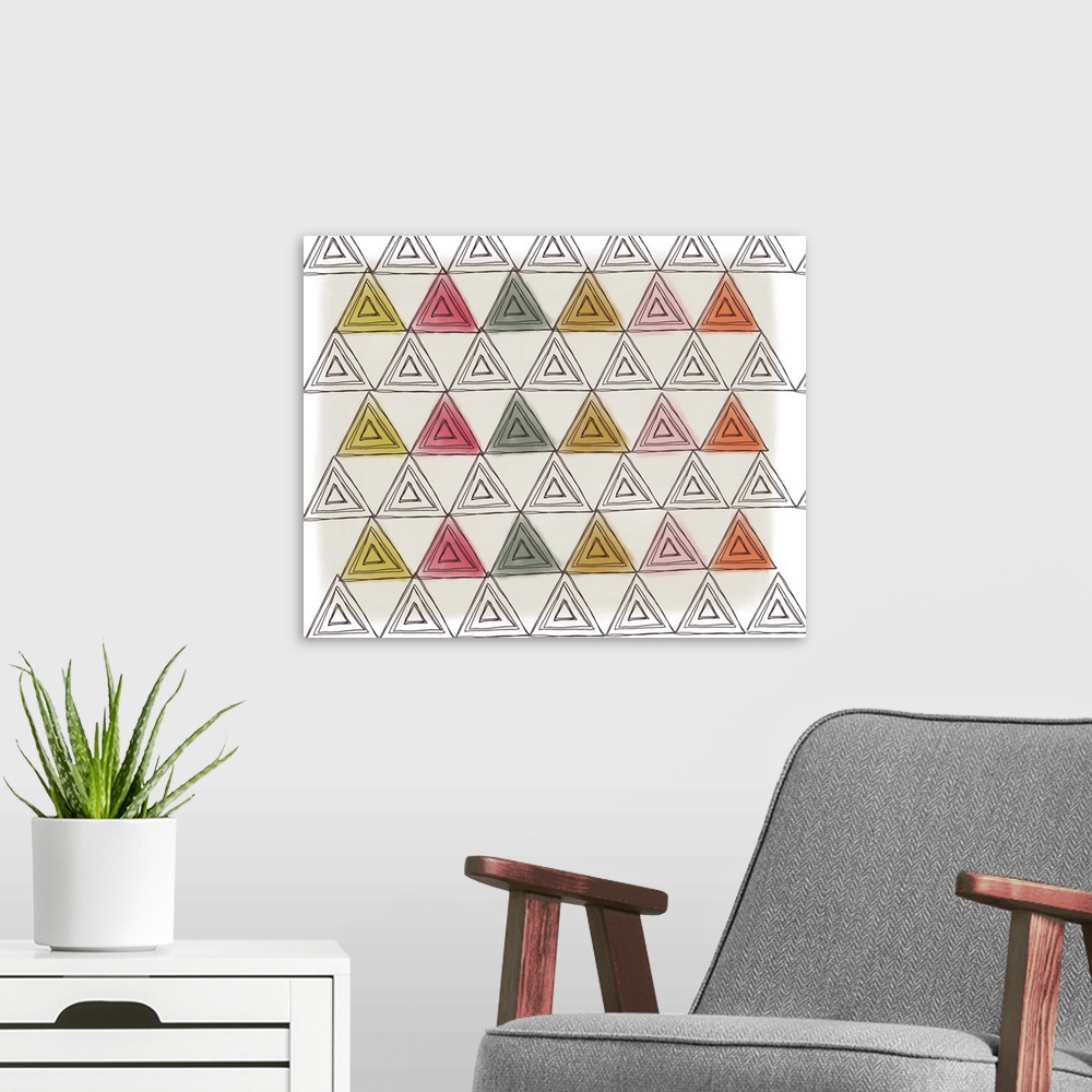 A modern room featuring Patterned illustration made up of triangles in shades of green, yellow, orange, and pink.