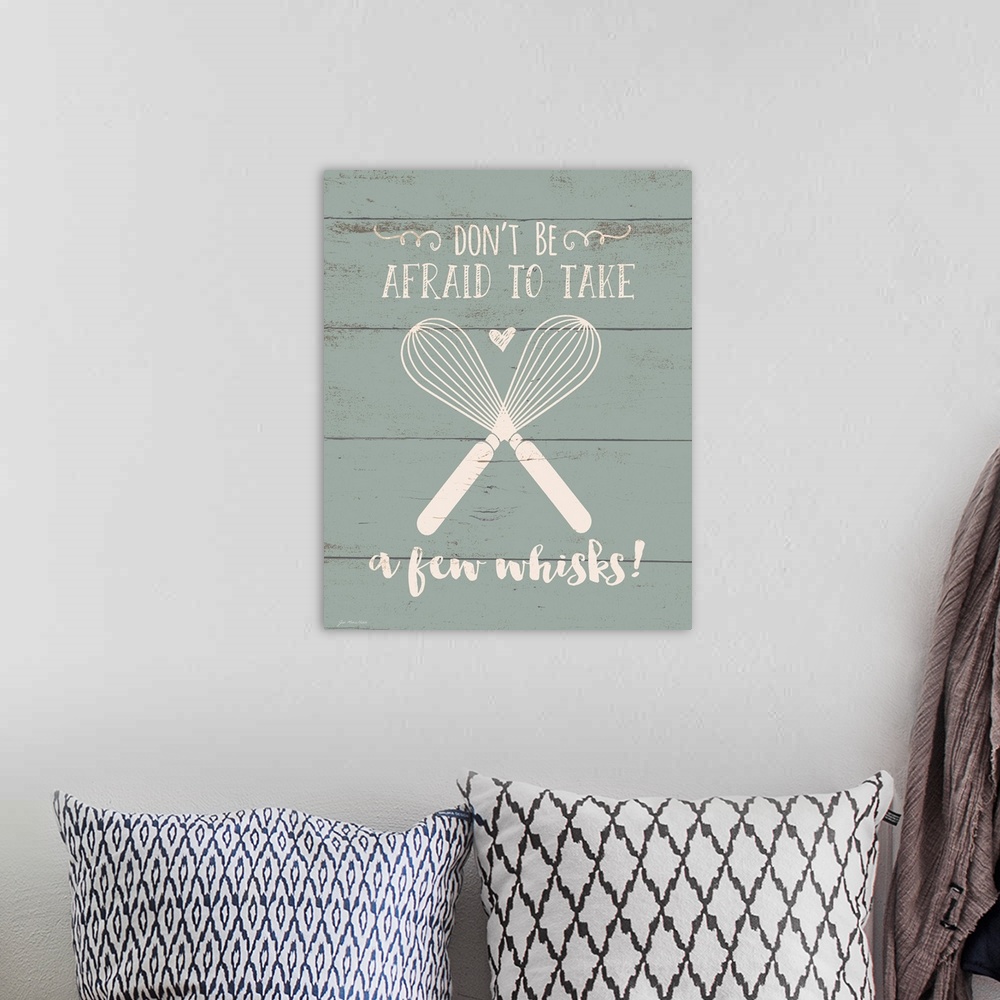 A bohemian room featuring Contemporary art of two crossed whisks with inspirational text above and below, on a background o...