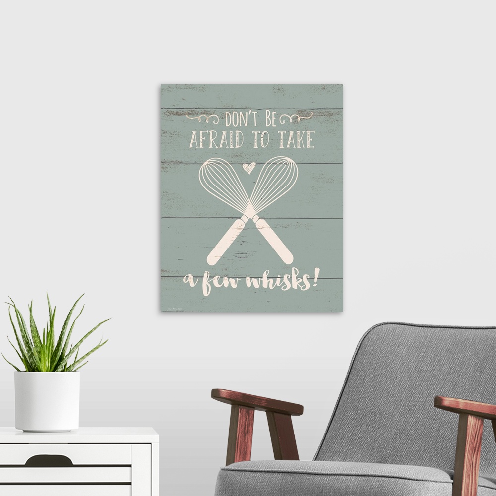 A modern room featuring Contemporary art of two crossed whisks with inspirational text above and below, on a background o...