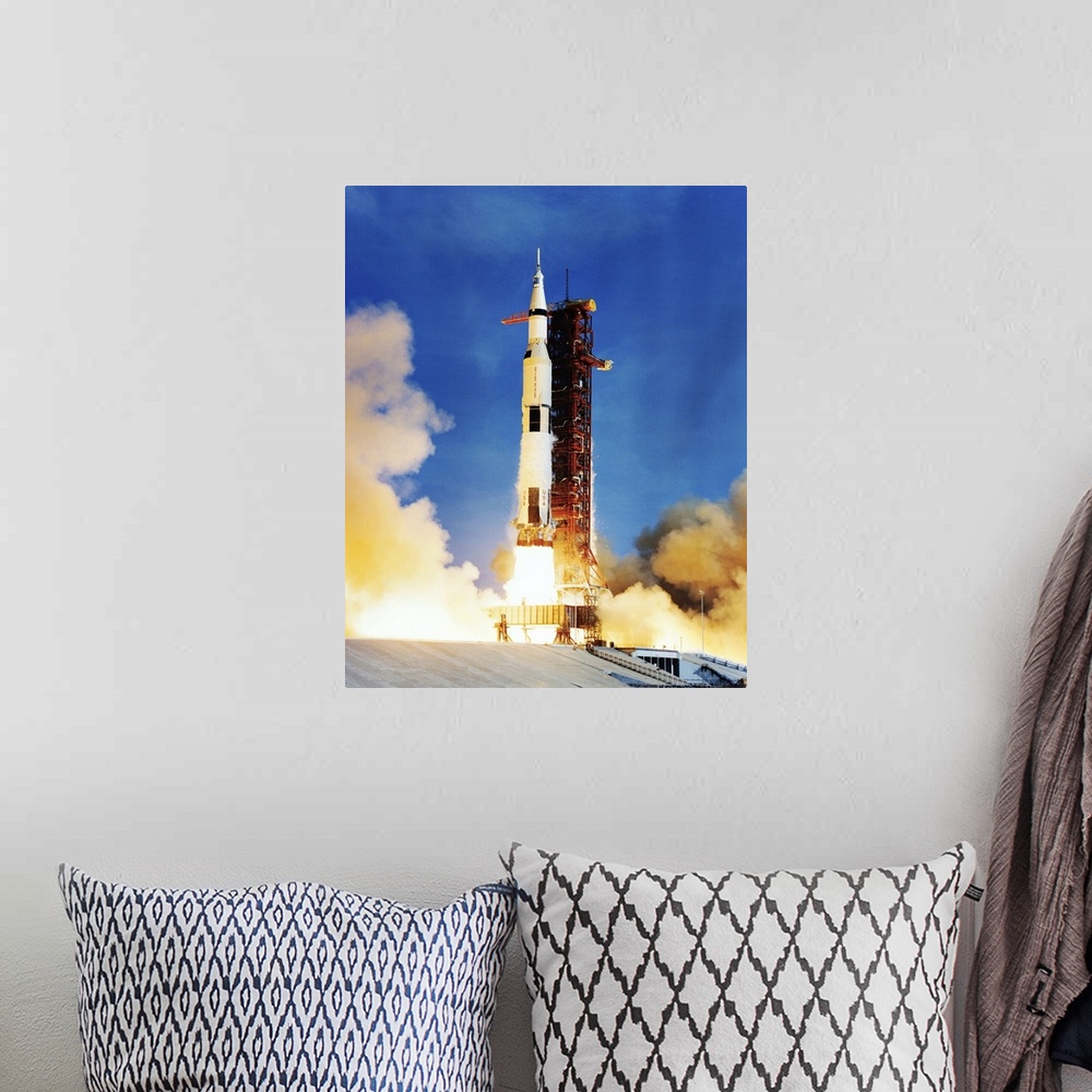A bohemian room featuring Apollo 11 spacecraft launching on top of a Saturn V rocket from Kennedy Space Center, Florida, US...